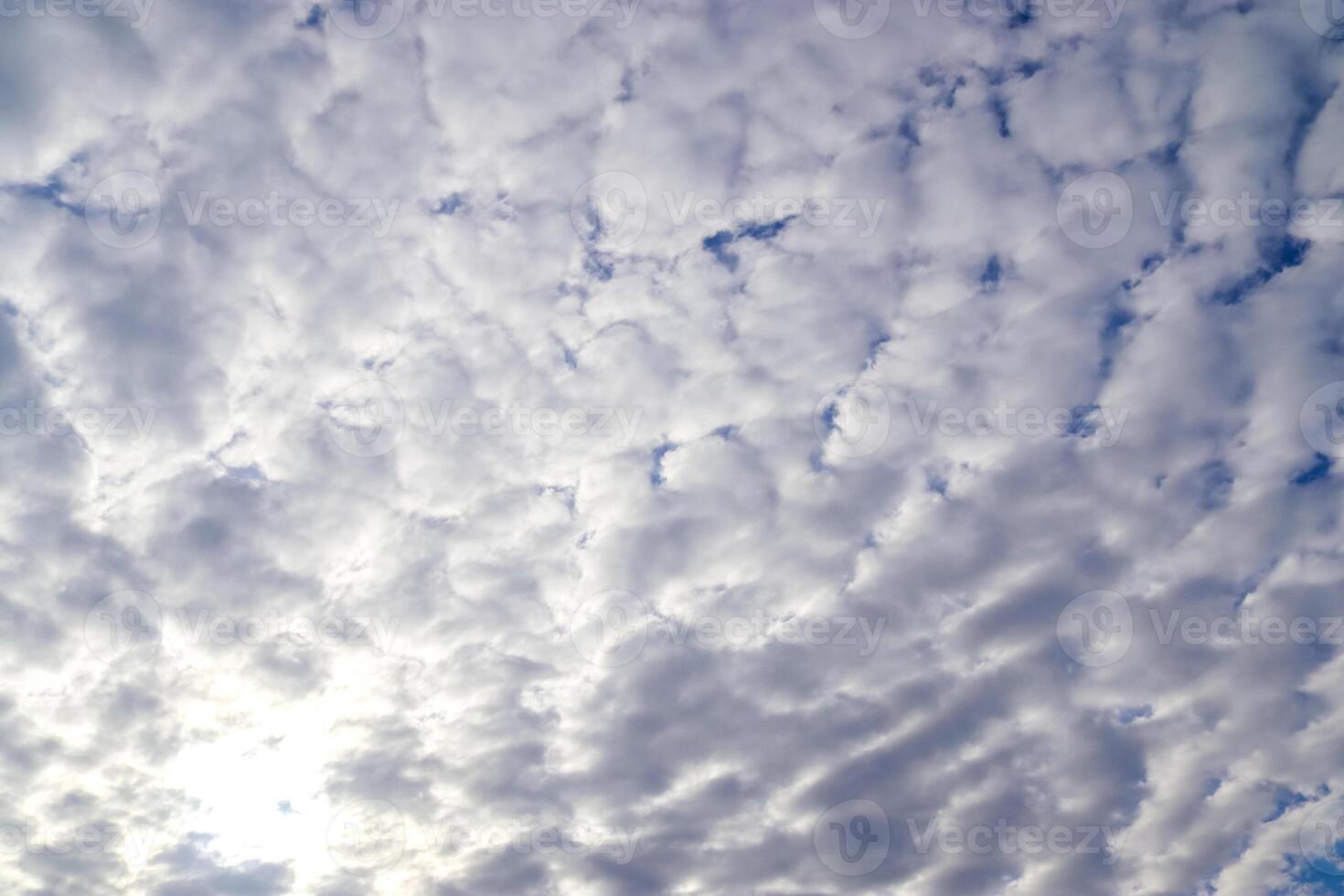 The carefree atmosphere of summer captured in a sky full of bright clouds. photo