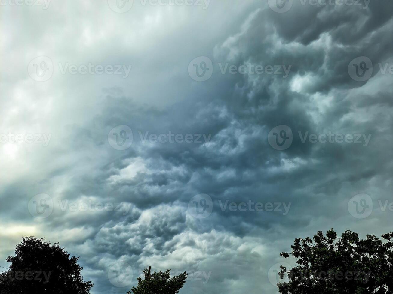 Dark storm clouds form in the sky ahead of a thunderstorm. photo