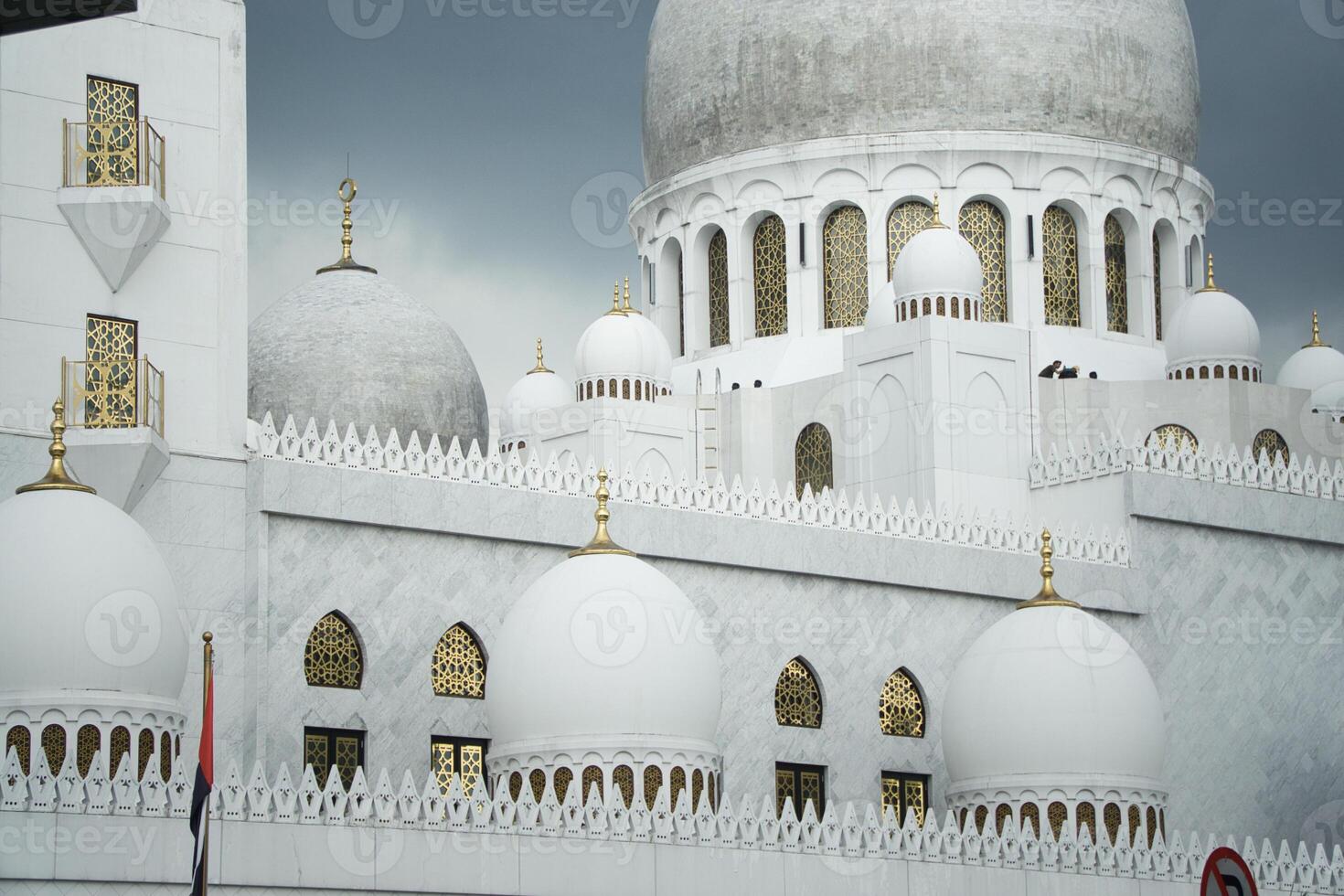 Spiritualy Majestic Sheikh Zayed Grand Mosque Domes Against a Dramatic Overcast Sky photo