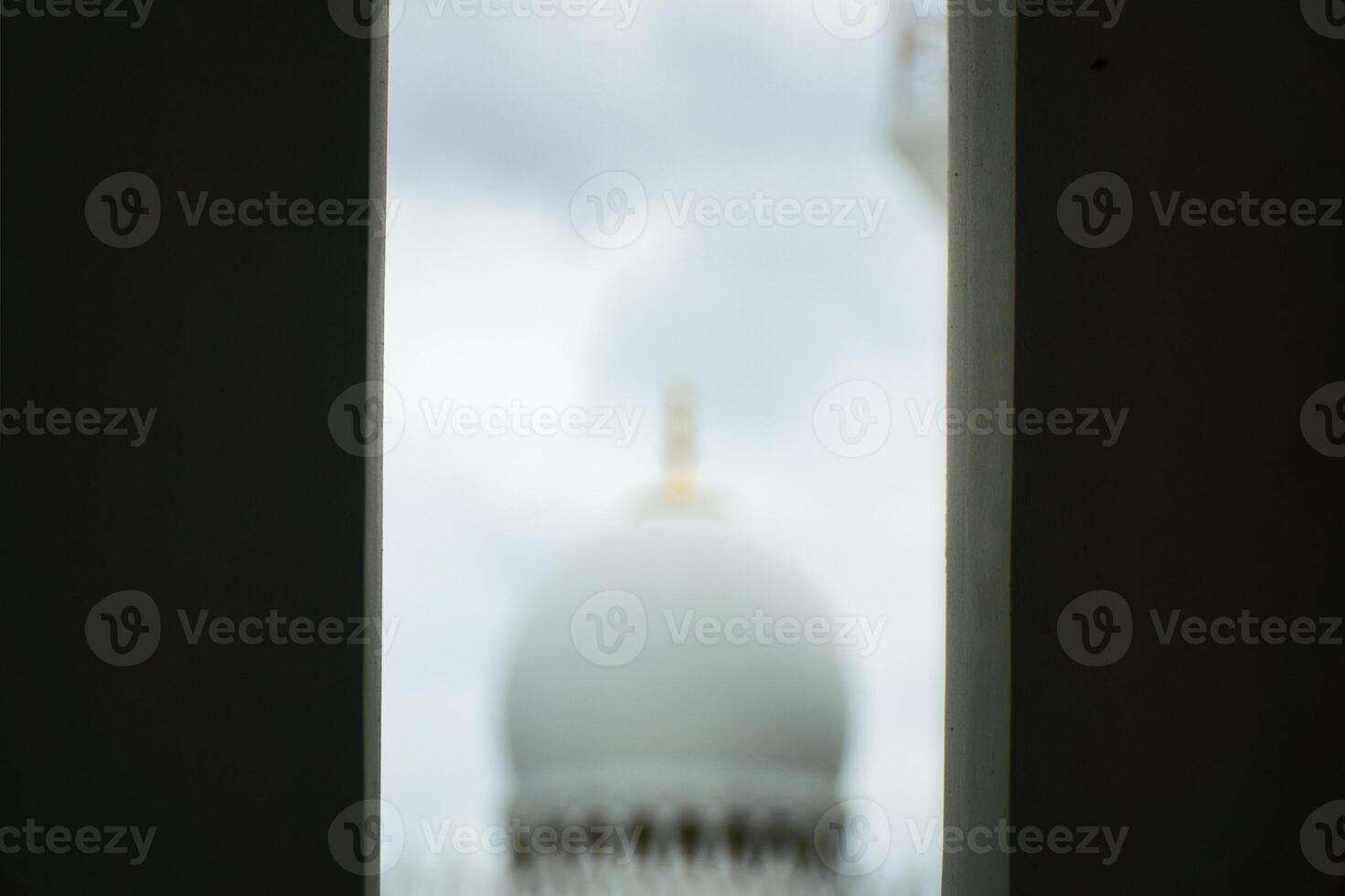 Abstract View of a Distant Sheikh Zayed Grand Mosque Dome Framed by Rectangular Structure photo
