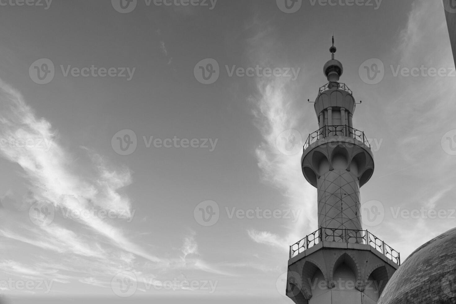 Elegant Monochrome Photograph of Islamic Minaret of Sheikh Zayed Grand Mosque Against Dramatic Sky photo