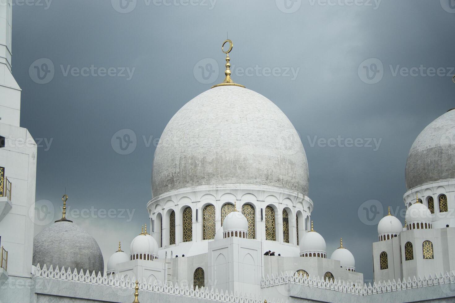 Sheikh Zayed Grand Mosque Domes Against a Dramatic Overcast Sky photo