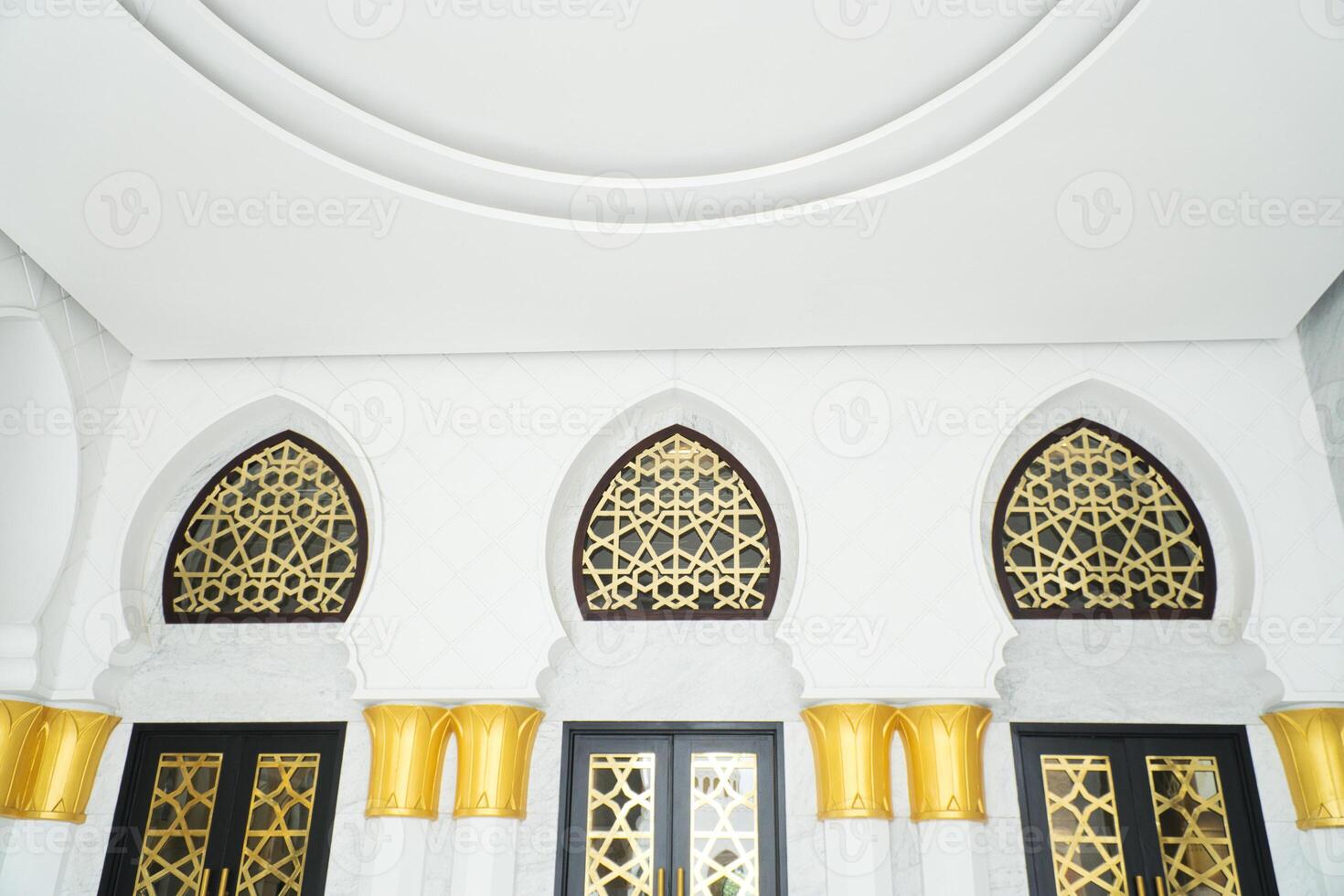 Elegant Interior Design with Ornate Gold Patterns on Artistic Arched Windows photo