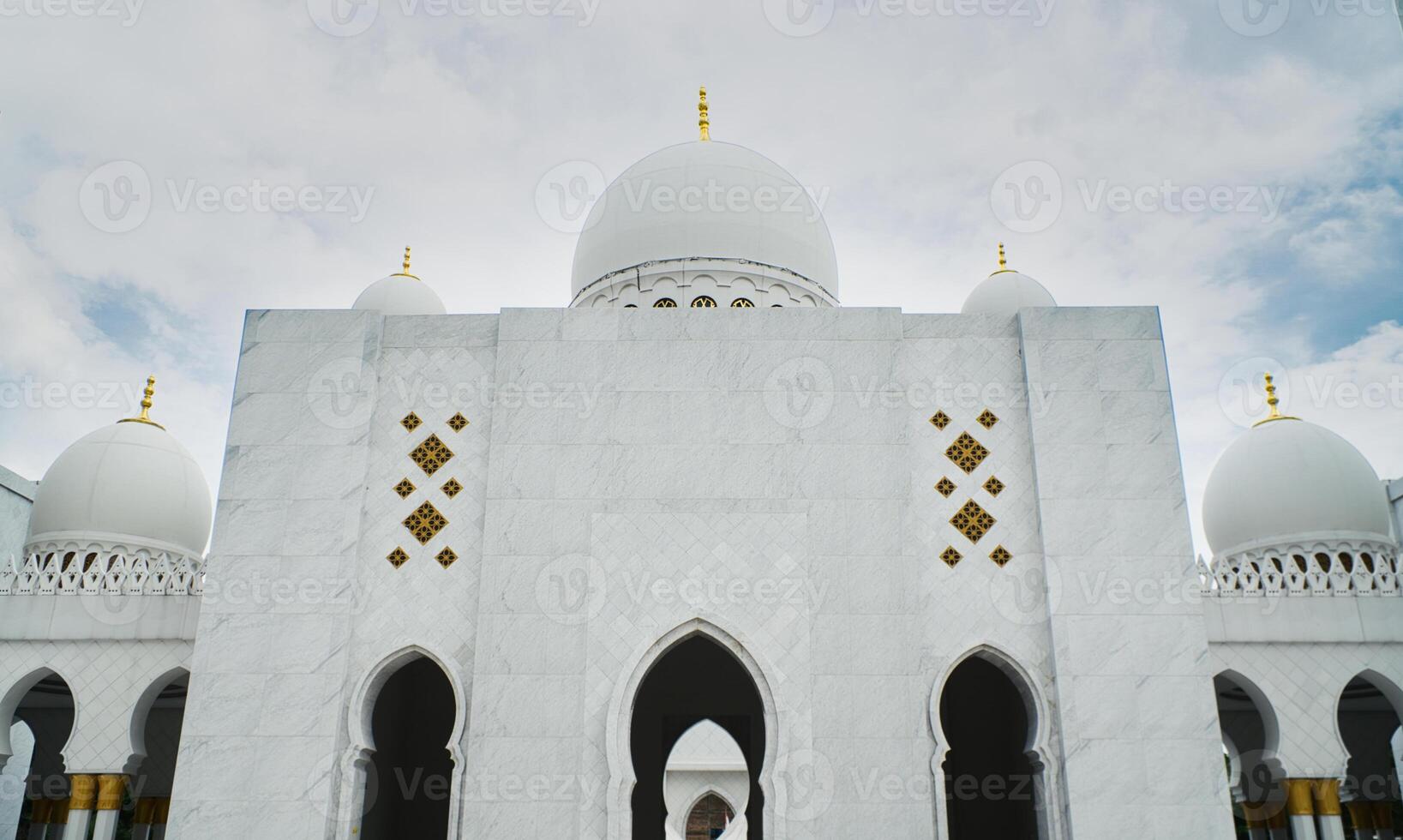 Elegant Sheikh Zayed Grand Mosque White Dome of a Marble Building Against a Vibrant Sky photo