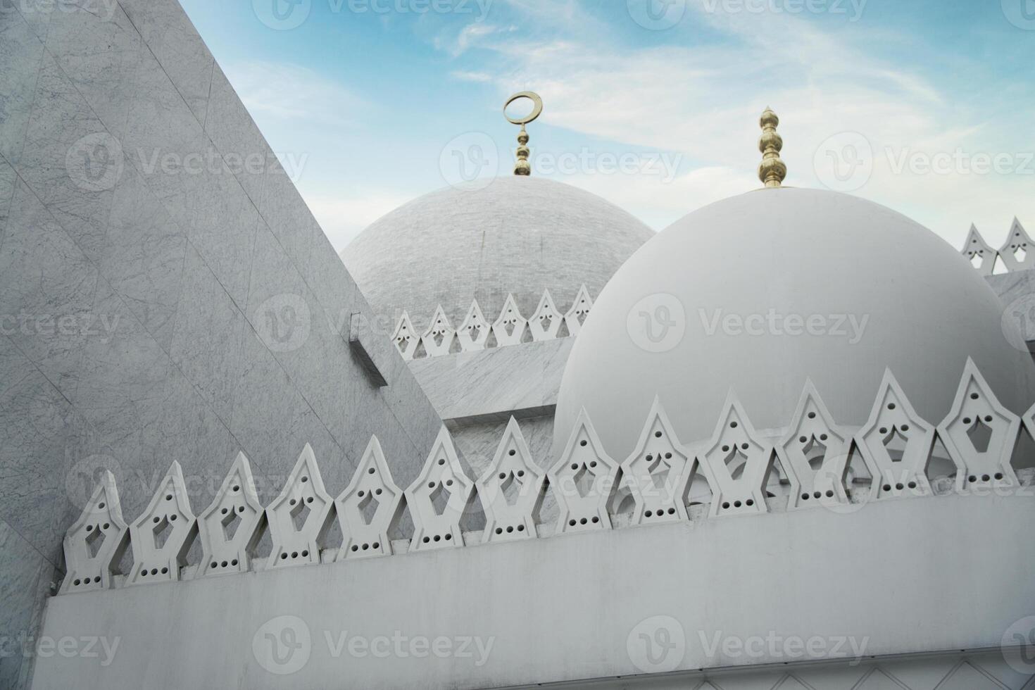 Sheikh Zayed Grand Mosque Dome of a Marble Building Against a Vibrant Sky photo