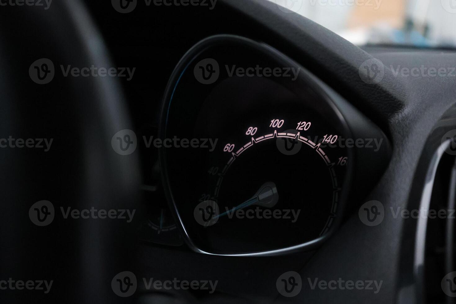 Close up shot of a speedometer in a car. At an engine speed of 1800 rpm on Car dashboard. photo