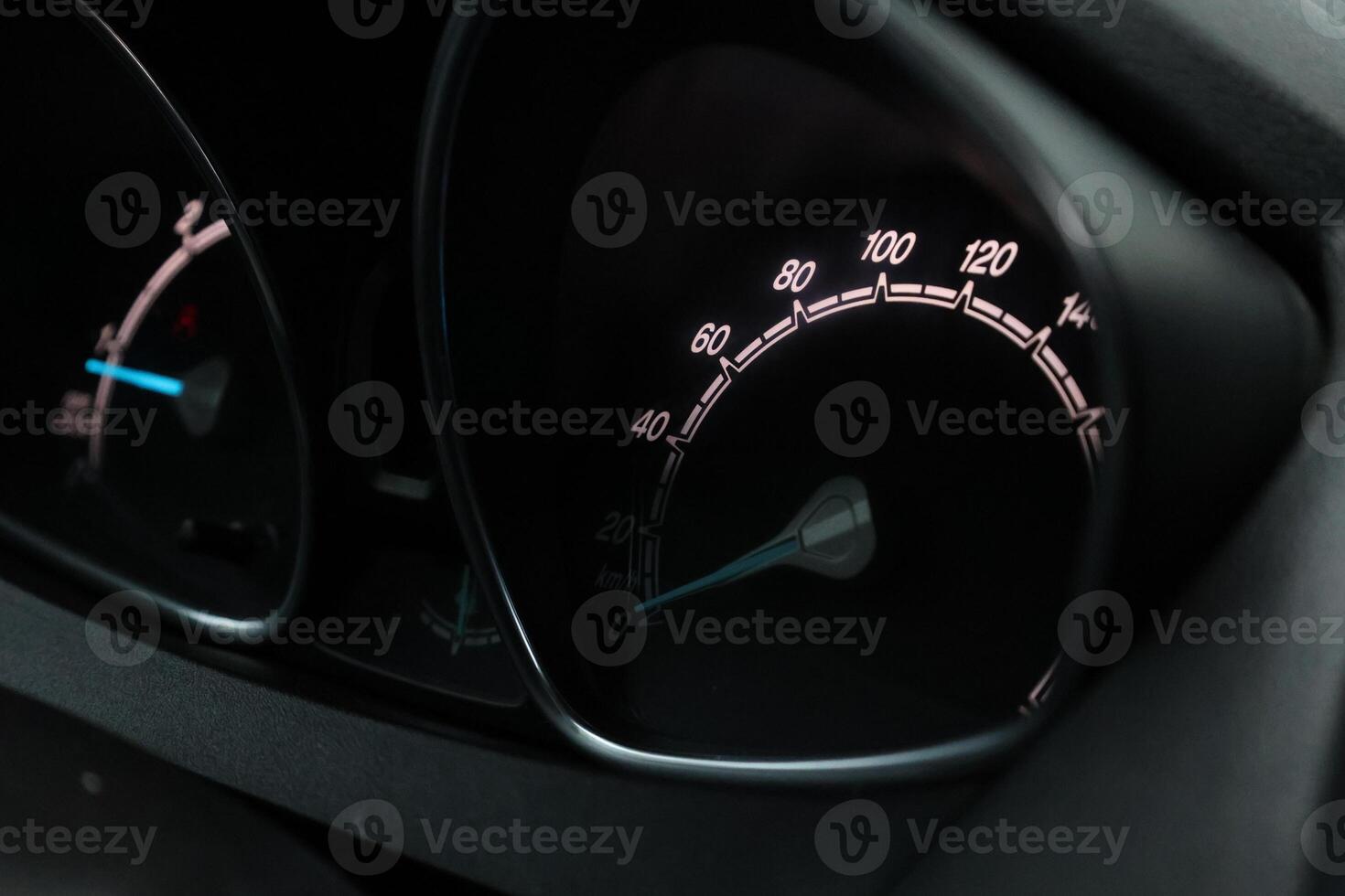 Close up shot of a speedometer in a car. At an engine speed photo