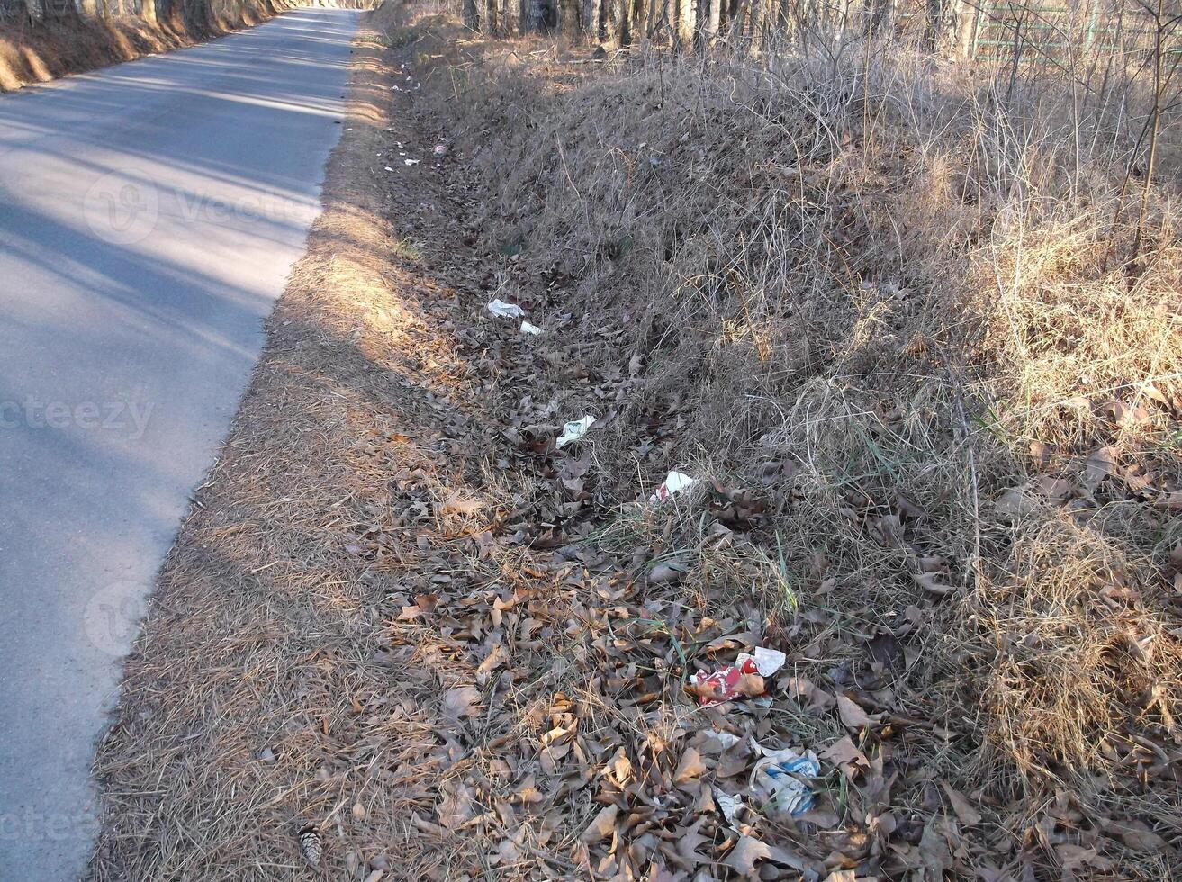 A road with trash on the side of it photo