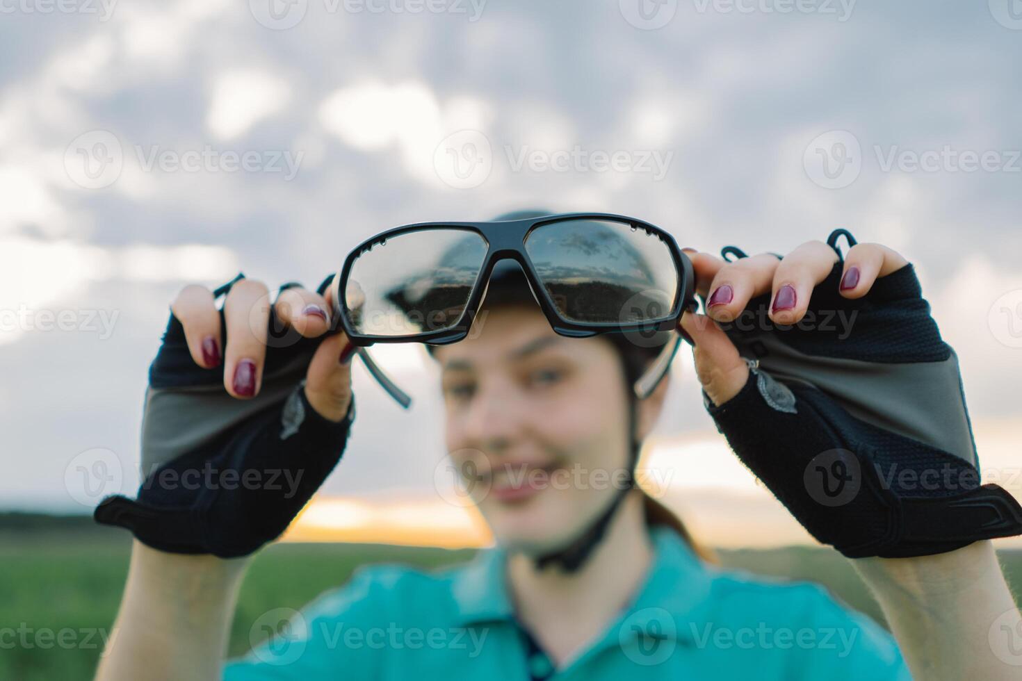 Woman Wearing Cycling Glasses and Helmet in Field photo