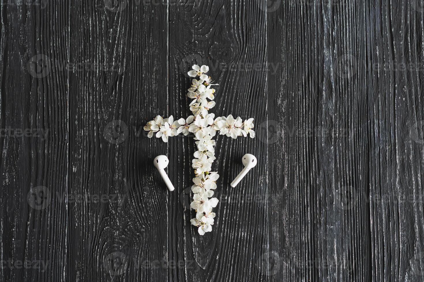Spring flowers in the shape of a cross. The concept of Christian music. photo