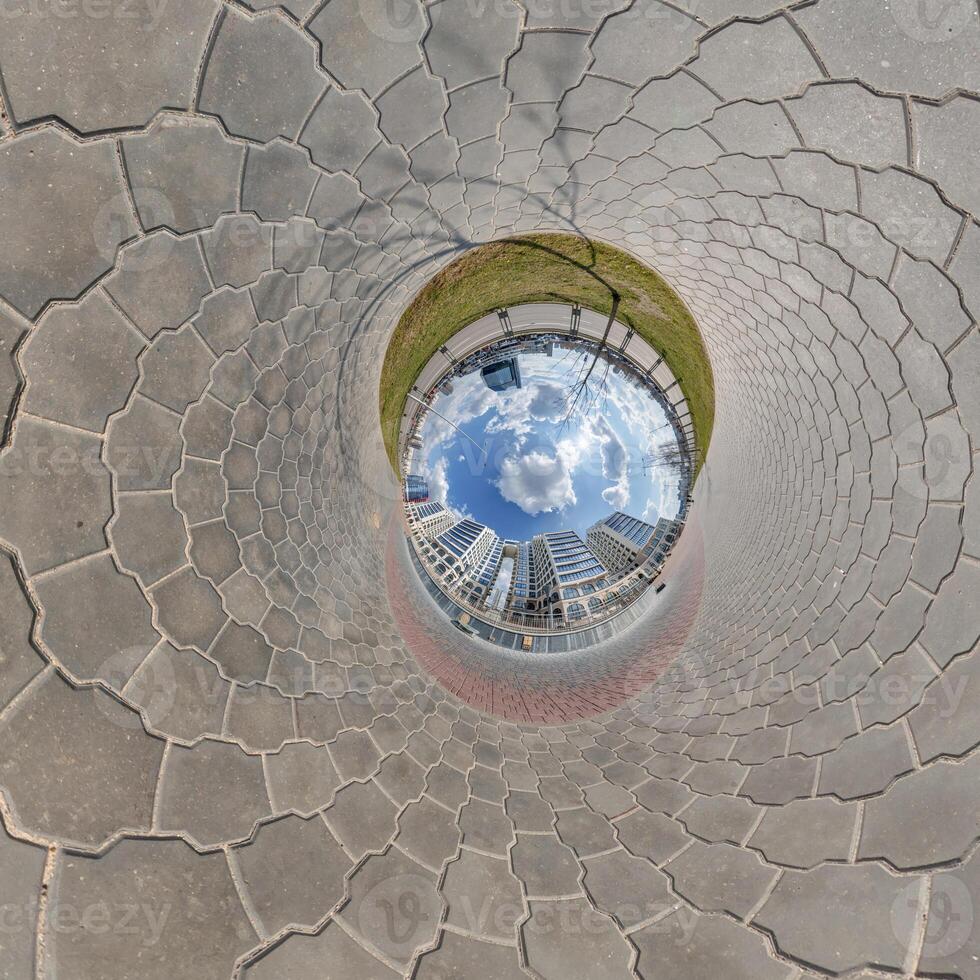 blue sphere inside overlooking old town, urban development, historic buildings surrounded by a frame of paving slabs. Transformation of spherical 360 panorama in aerial view. photo