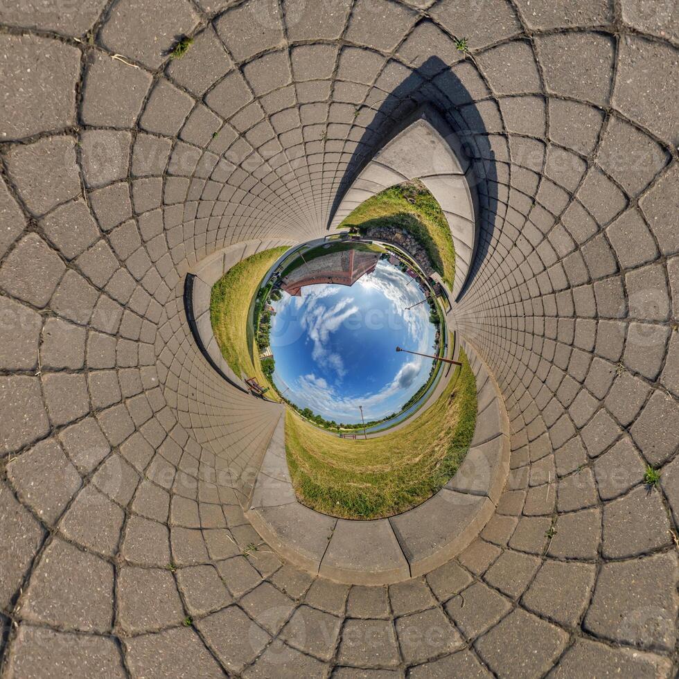 blue sphere inside overlooking old town, urban development, historic buildings surrounded by a frame of paving slabs. Transformation of spherical 360 panorama in abstractview. photo