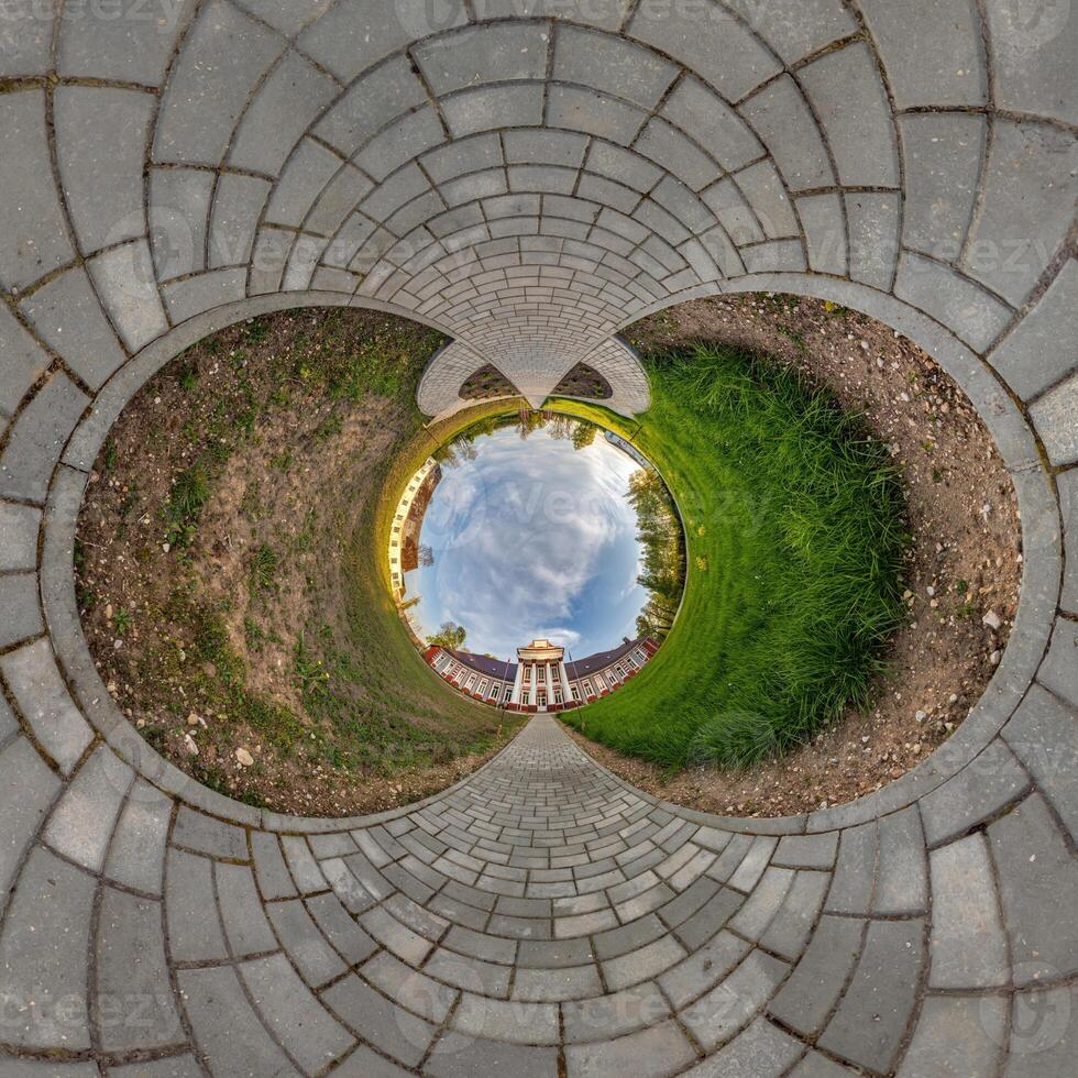 blue sphere inside overlooking old town, urban development, historic buildings surrounded by a frame of paving slabs. Transformation of spherical 360 photo