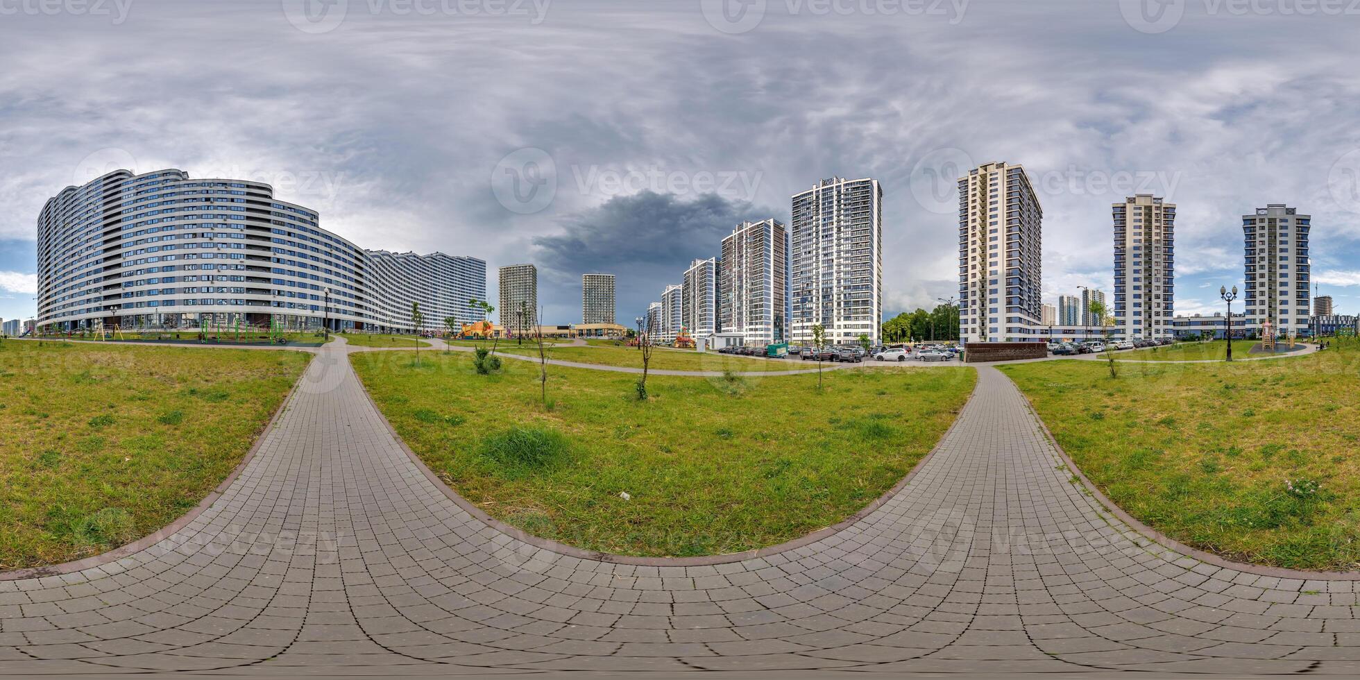 360 panorama near new skyscrapers and residential complex before storm with dark sky in full equirectangular seamless spherical projection photo