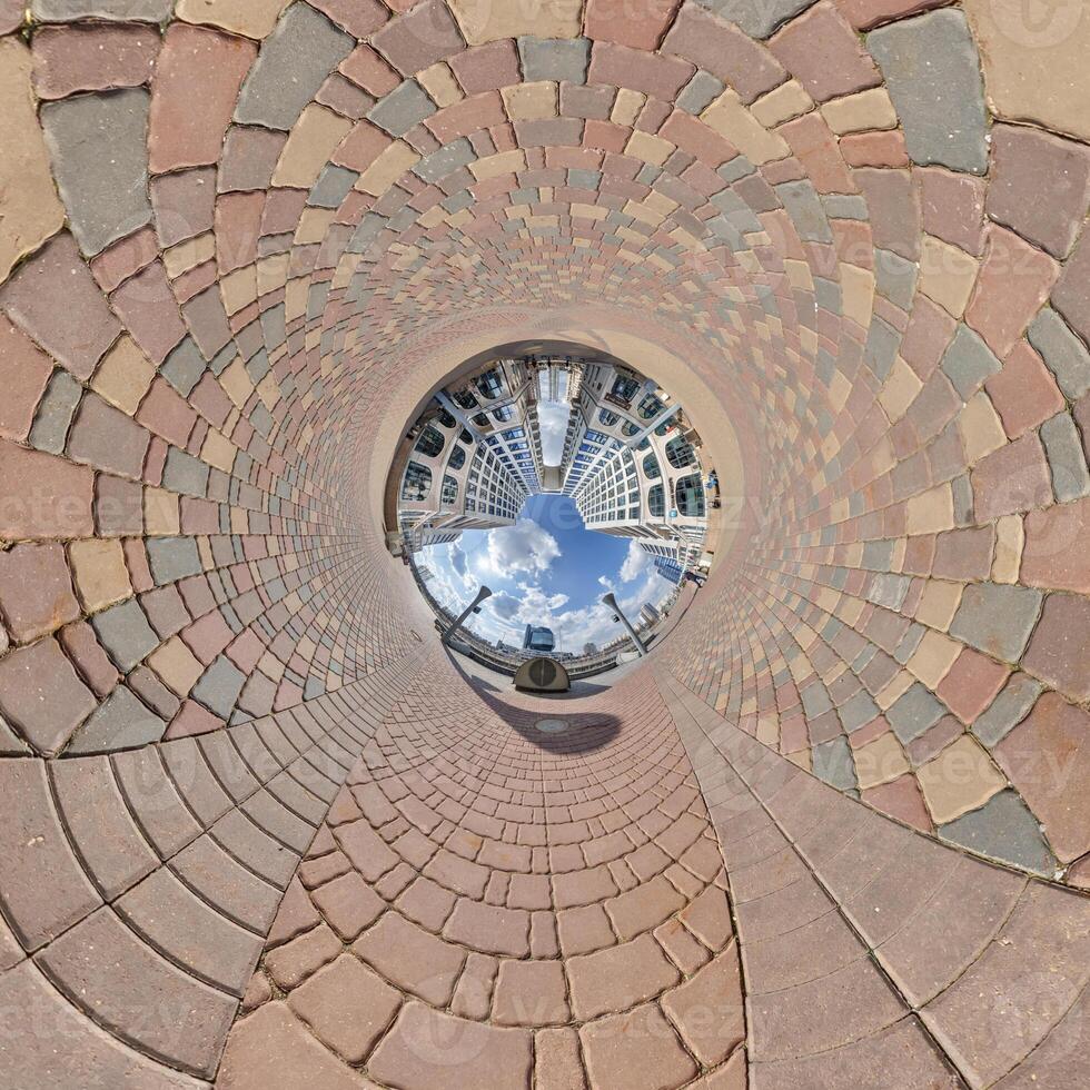 development, historic buildings surrounded by a frame of paving slabs. Transformation of spherical 360 panorama in abstract aerial view. photo