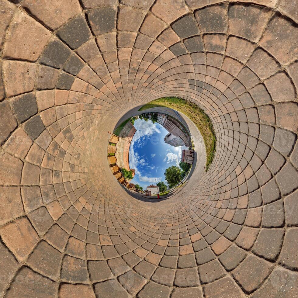blue sphere overlooking old town, urban development, historic buildings surrounded by a frame of paving slabs. Transformation of spherical 360 panorama in abstract aerial view. photo
