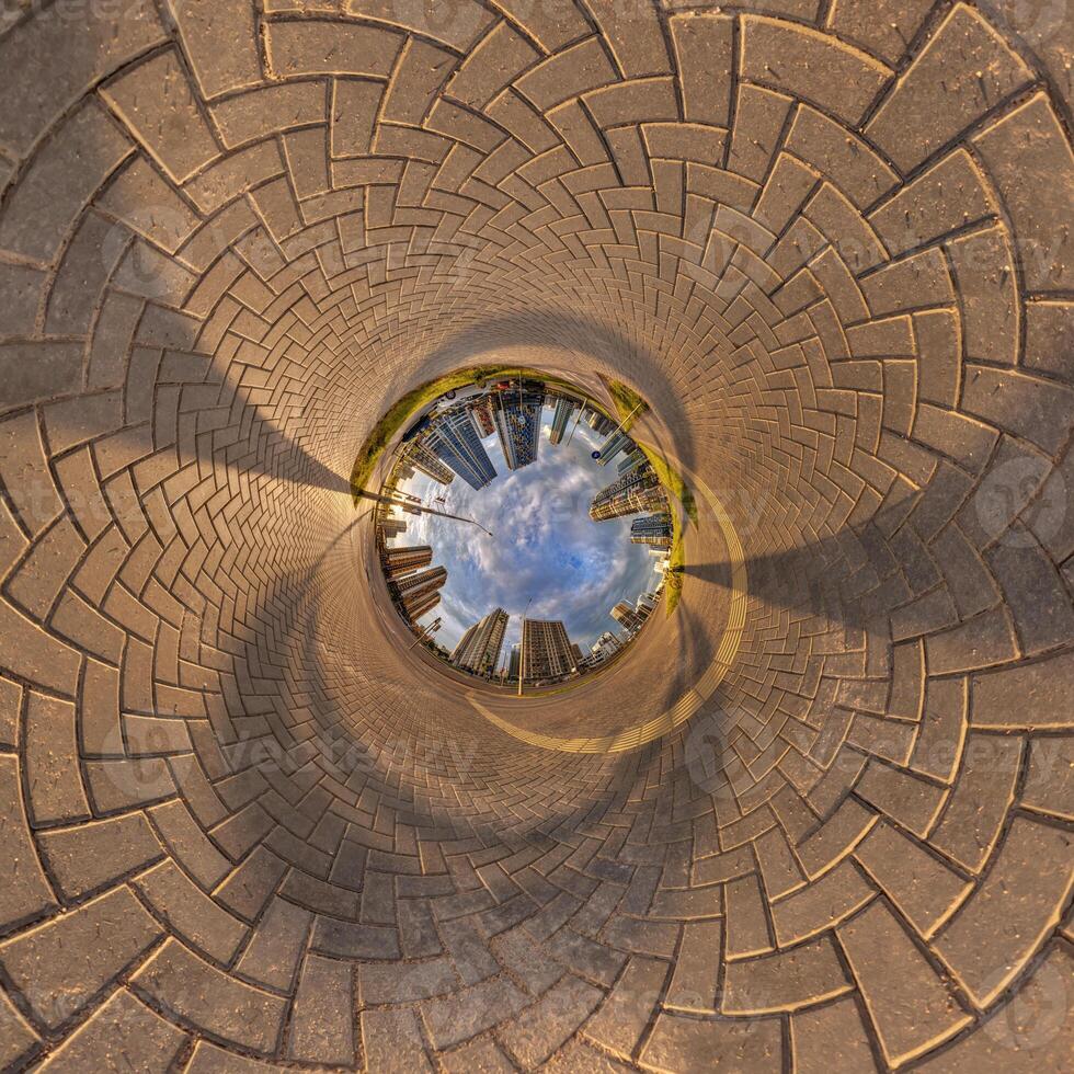 blue sphere inside overlooking urban development, historic buildings surrounded by a frame of paving slabs. Transformation of spherical 360 panorama in abstract aerial view. photo