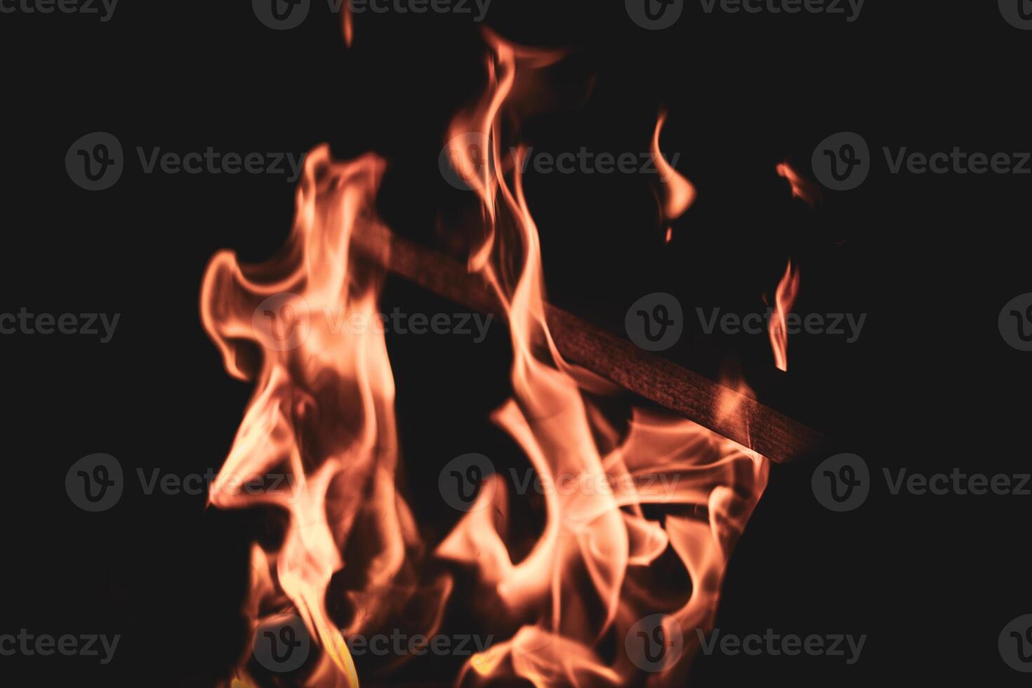 Fire flames on barbeque against the wall photo
