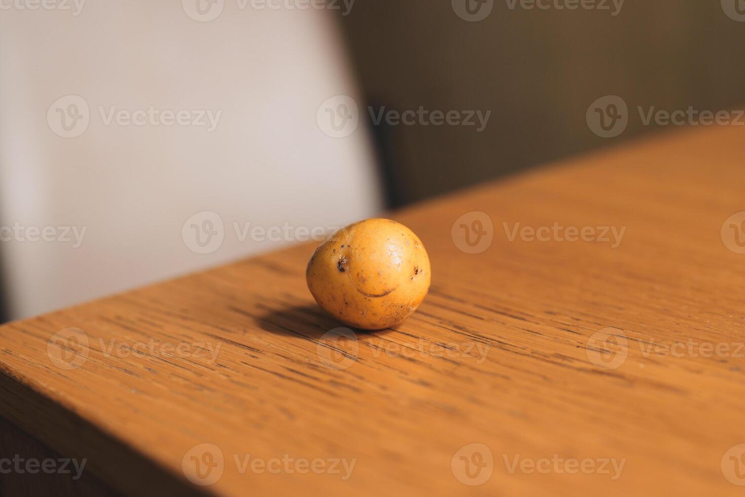 A whimsical potato character on a rustic table embodies joy, inviting smiles and laughter photo