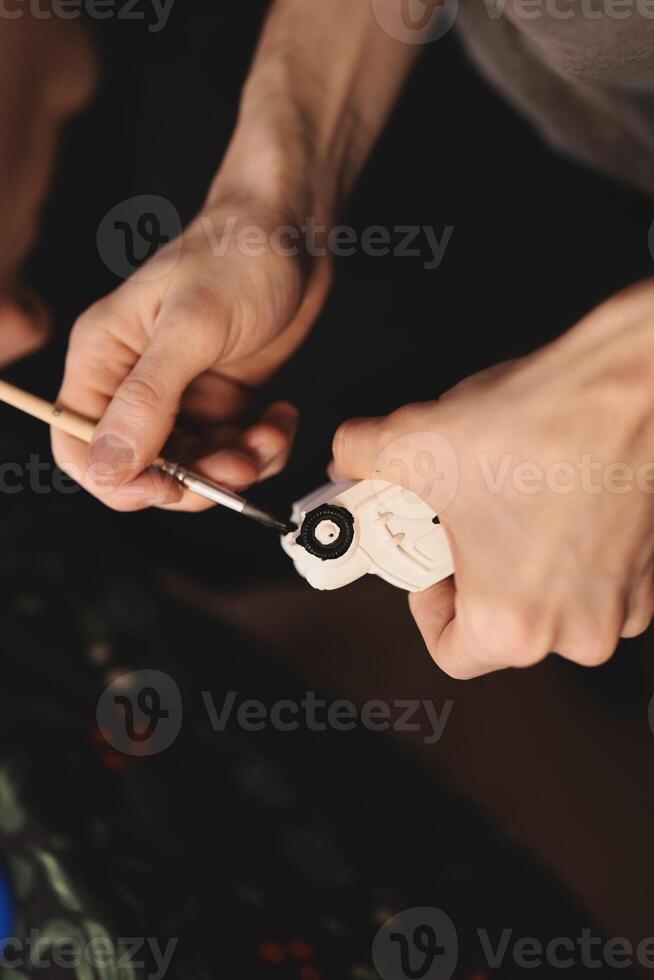Craftsmanship in Action A Detailed Painting Process of a Beautiful Wooden Object That Captivates photo