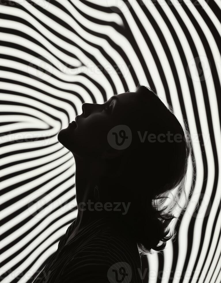 woman in black and white with abstract striped background photo
