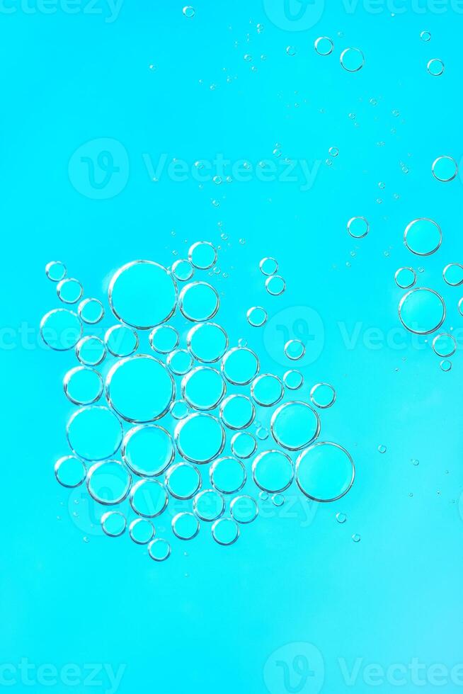 Delicate blue abstract background with numerous air bubbles floating in a soft gradient. Copy space photo