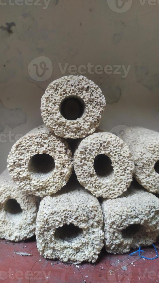 a pile of rocks with holes in them, photo