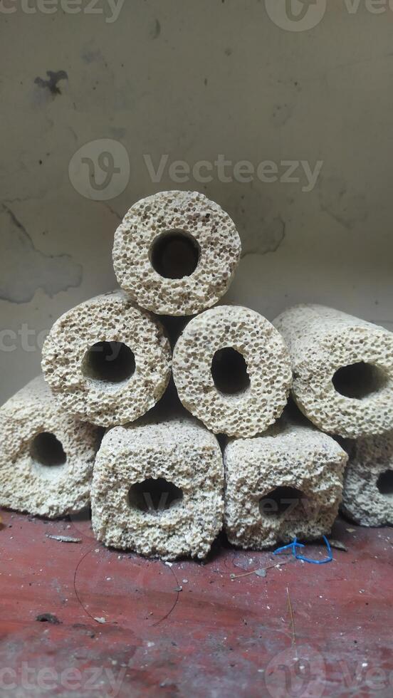 a pile of rocks with holes in them, close-up photo