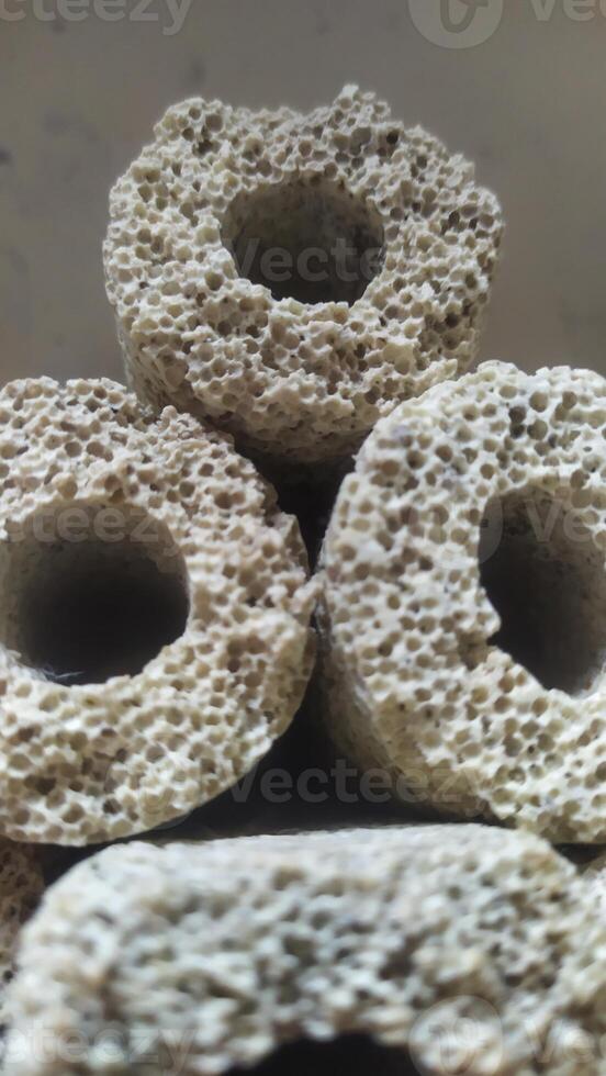 a pile of small round sponge rings sitting on top of each other photo