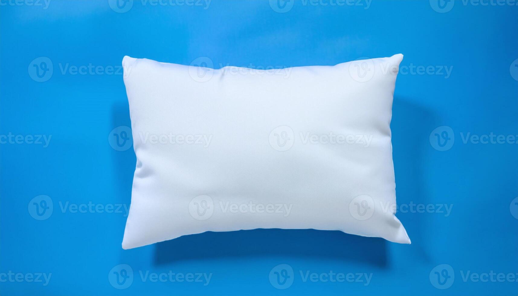 White Pillow Resting on a Blue Surface photo