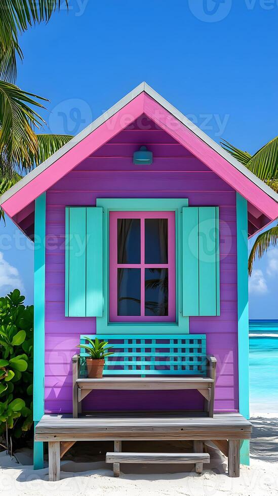 Vibrant beach house with colorful exterior set against a clear blue sky and serene ocean backdrop photo