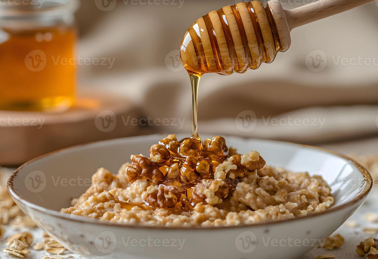 Delicious bowl of warm oatmeal topped with crunchy popcorn and drizzled with honey, perfect for a cozy breakfast at home during a chilly morning photo