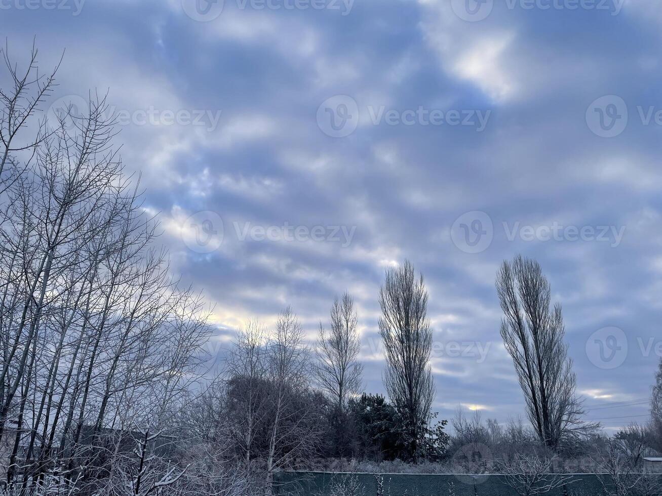 Winter sky in the village with soft pastel hues 12 photo