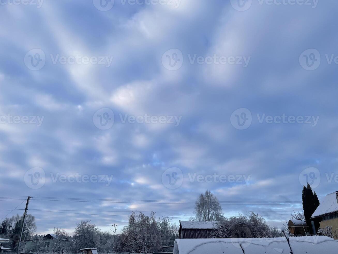 Winter sky in the village with soft pastel hues 27 photo