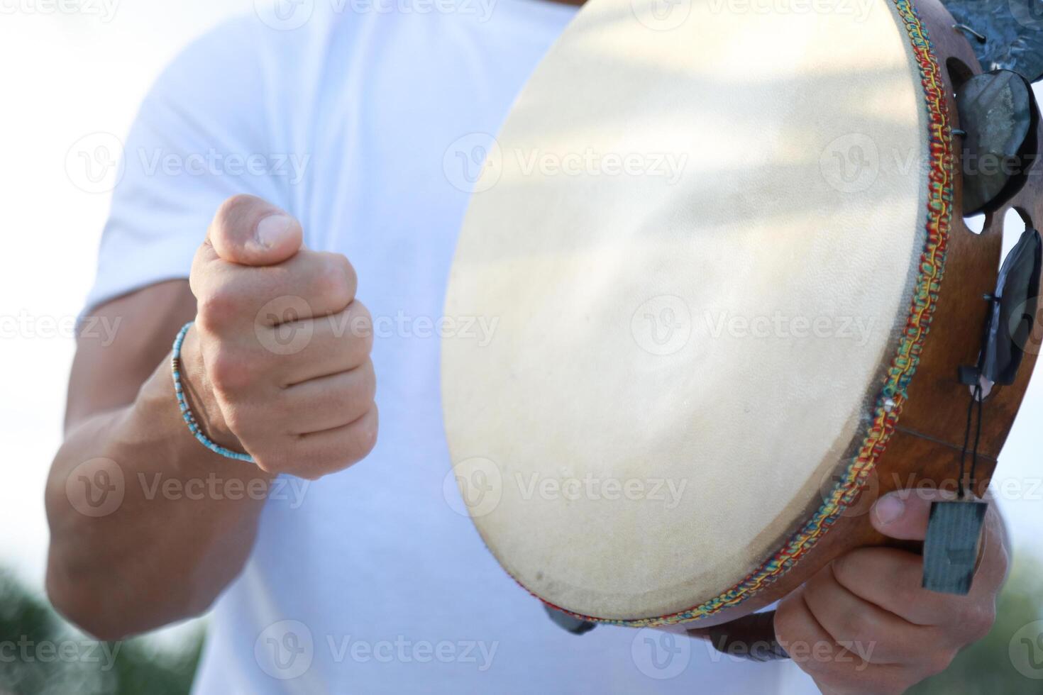 Joyful Tambourine Beats in Rolling Countryside photo
