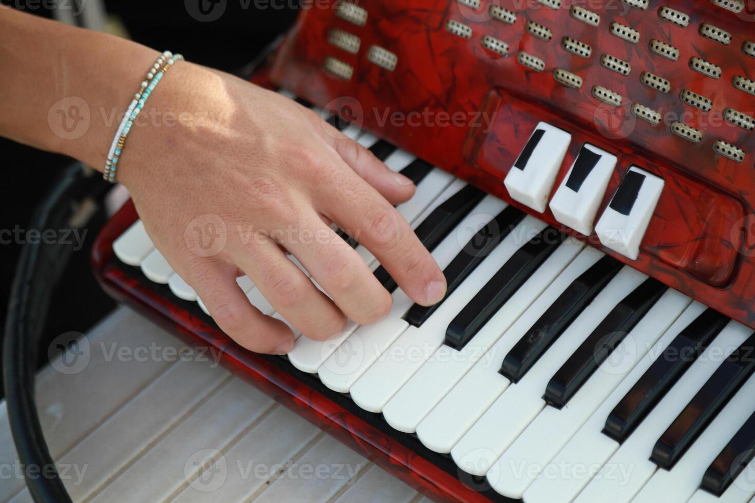 Hands Of A Player Preparing To Play Accordion photo