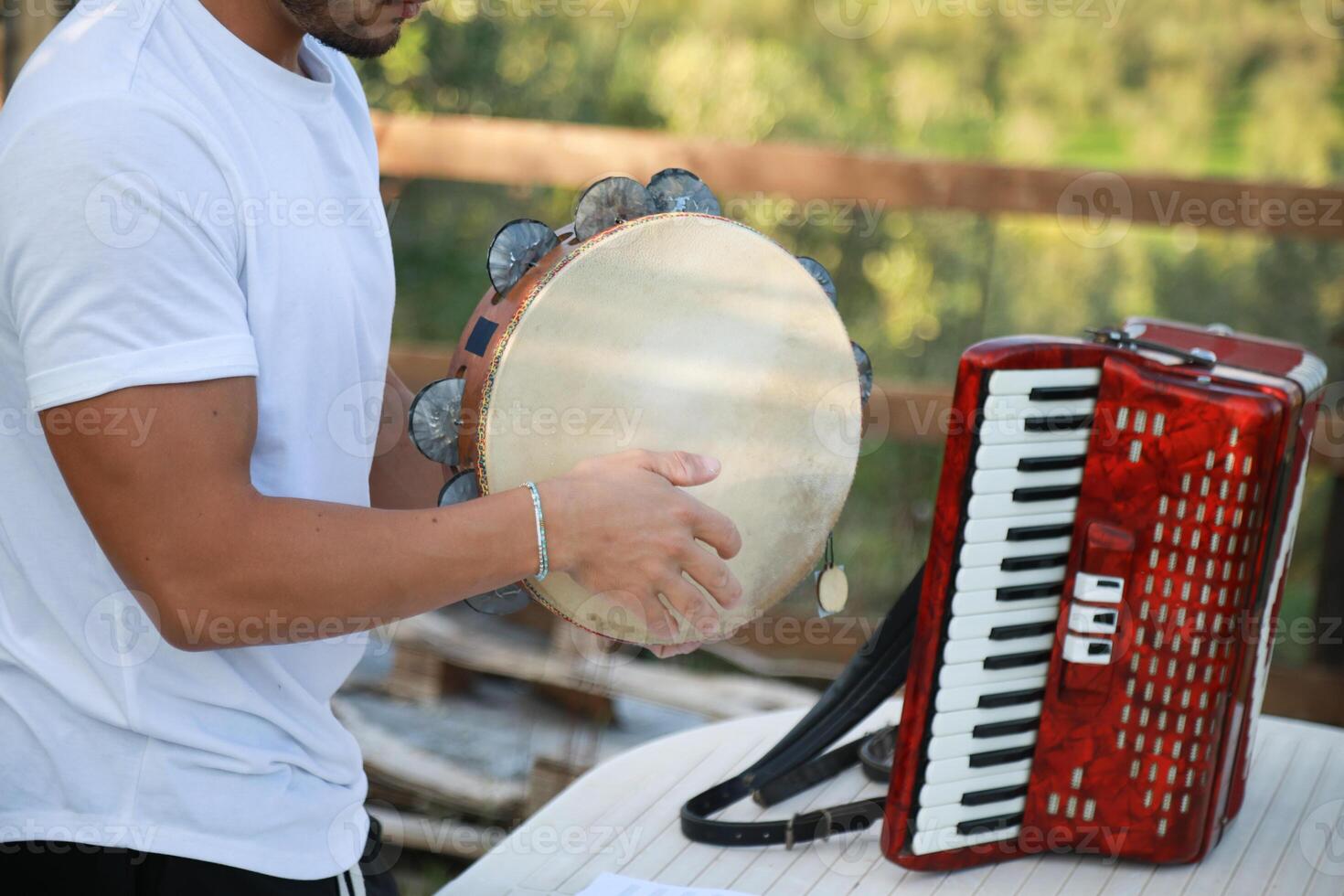Skilled Tambourine Player in Vast Countryside photo