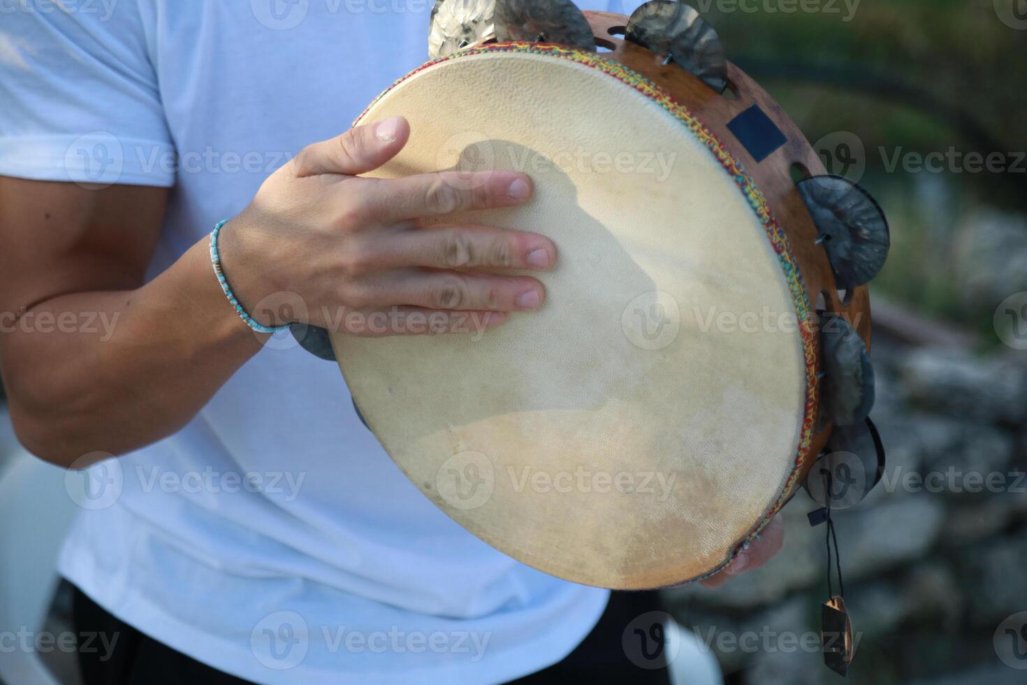 Joyful Tambourine Beats in Rolling Countryside photo