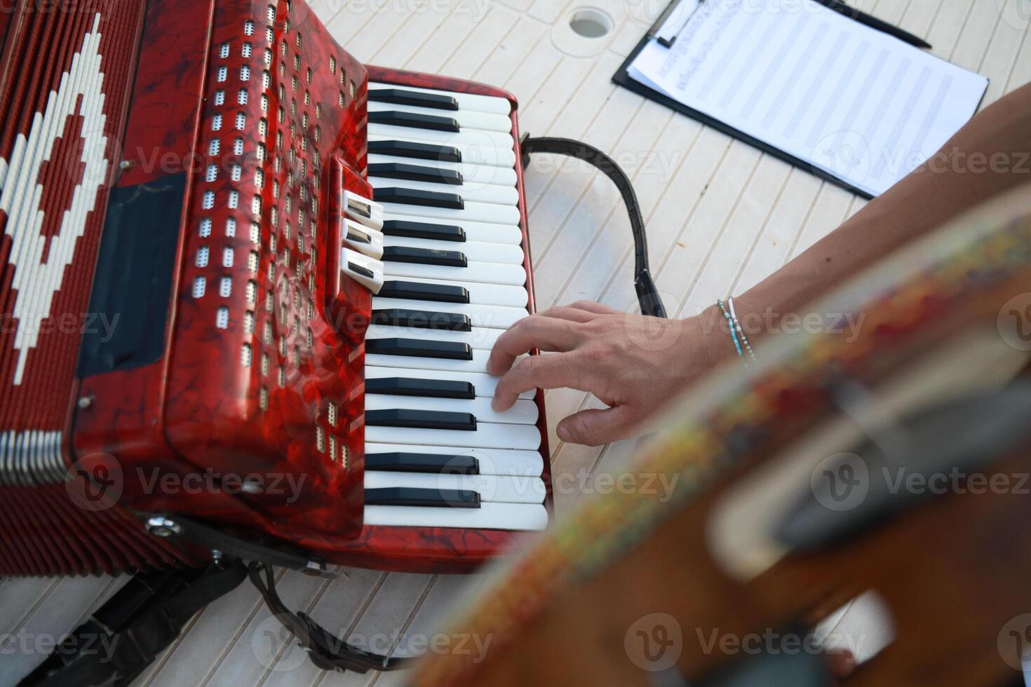 Musician's Fingers Dancing Over Accordion Keys photo