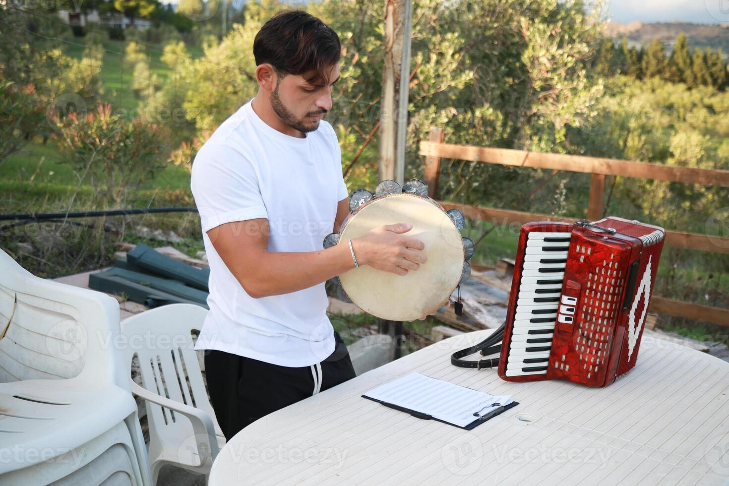 Skilled Tambourine Player in Vast Countryside photo