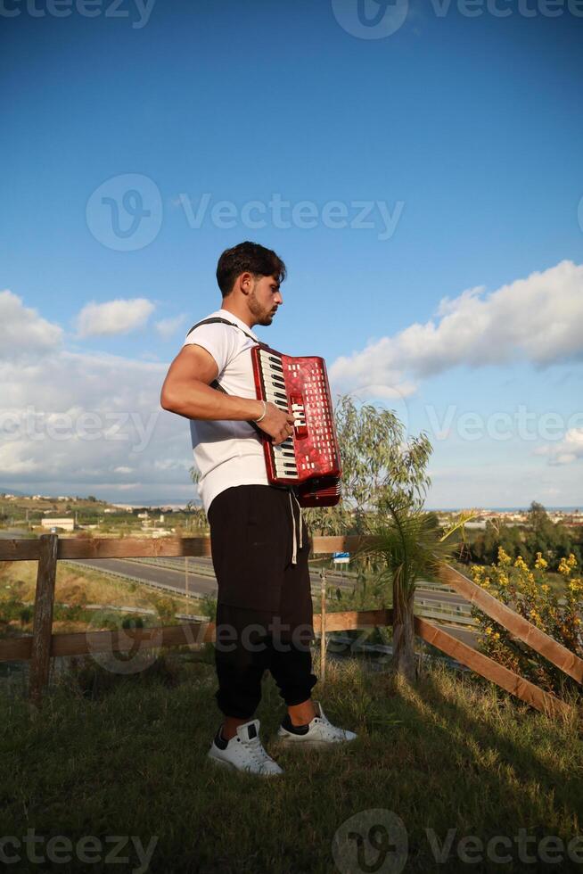 Dynamic Accordionist in Nature Embrace photo