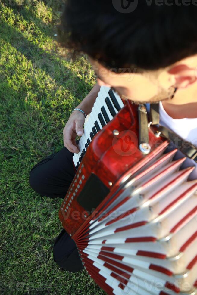 Joyful Melodies Flowing from Accordion Player photo