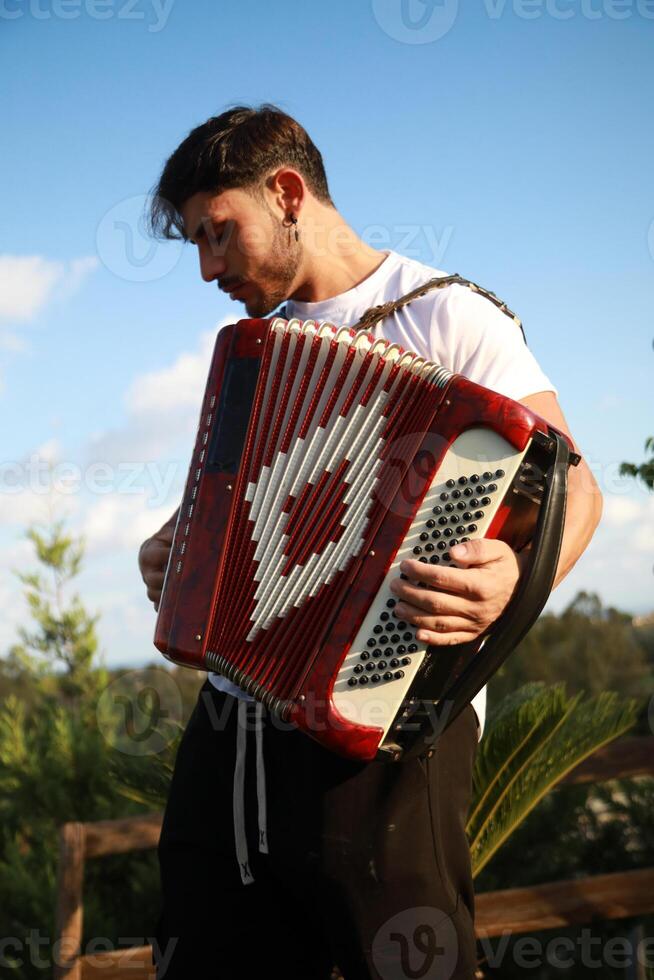 Dynamic Accordionist in Nature Embrace photo