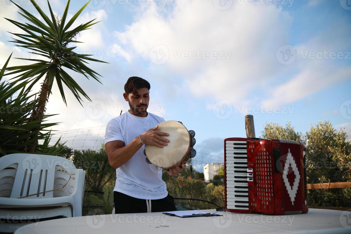Joyful Tambourine Beats in Rolling Countryside photo