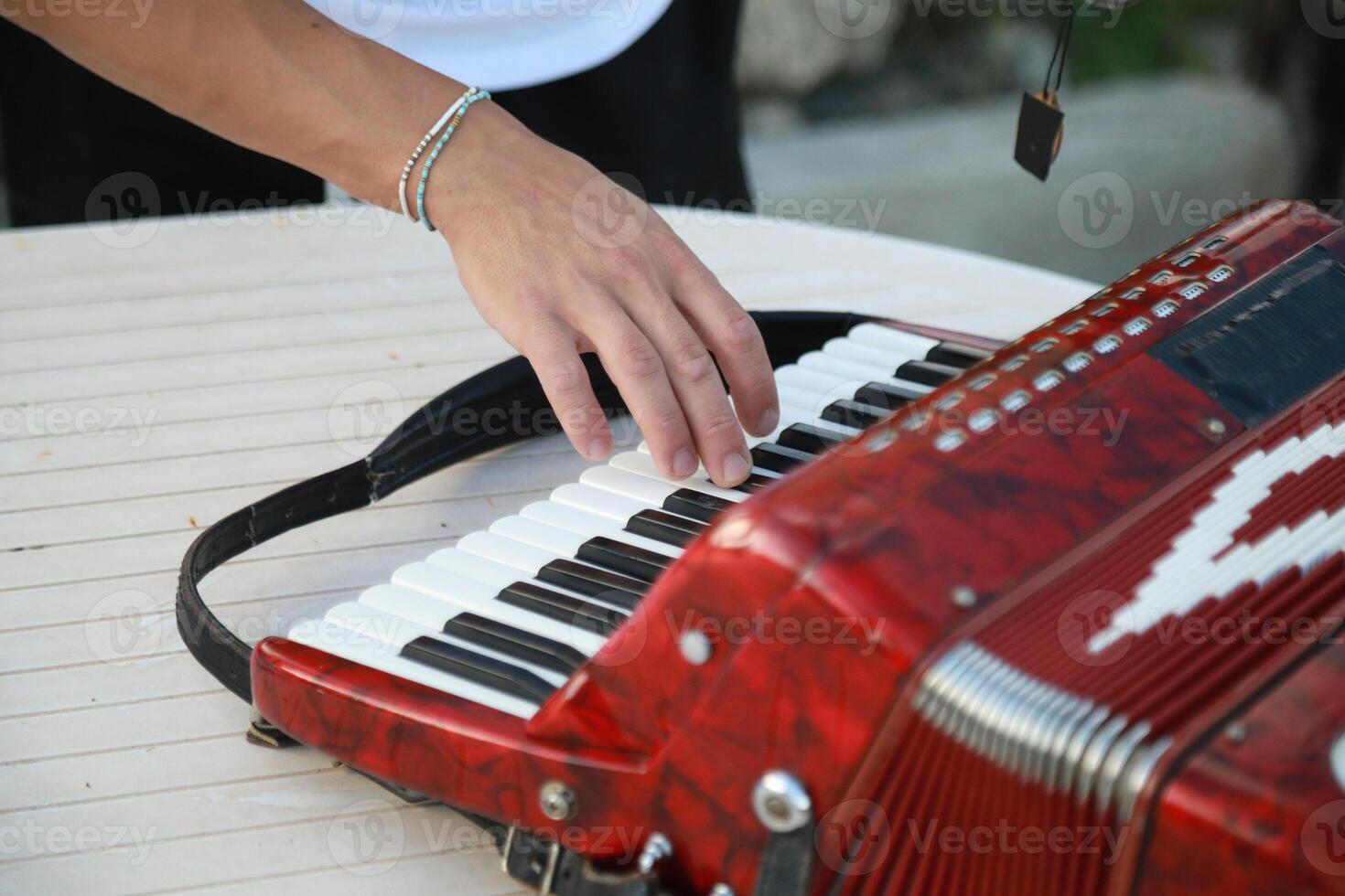 Musician's Fingers Dancing Over Accordion Keys photo