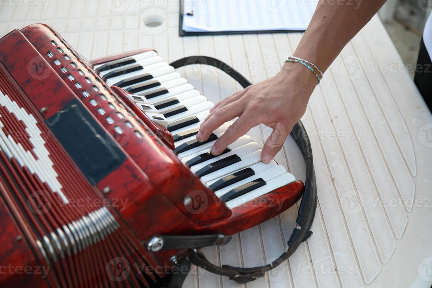Musician's Fingers Dancing Over Accordion Keys photo