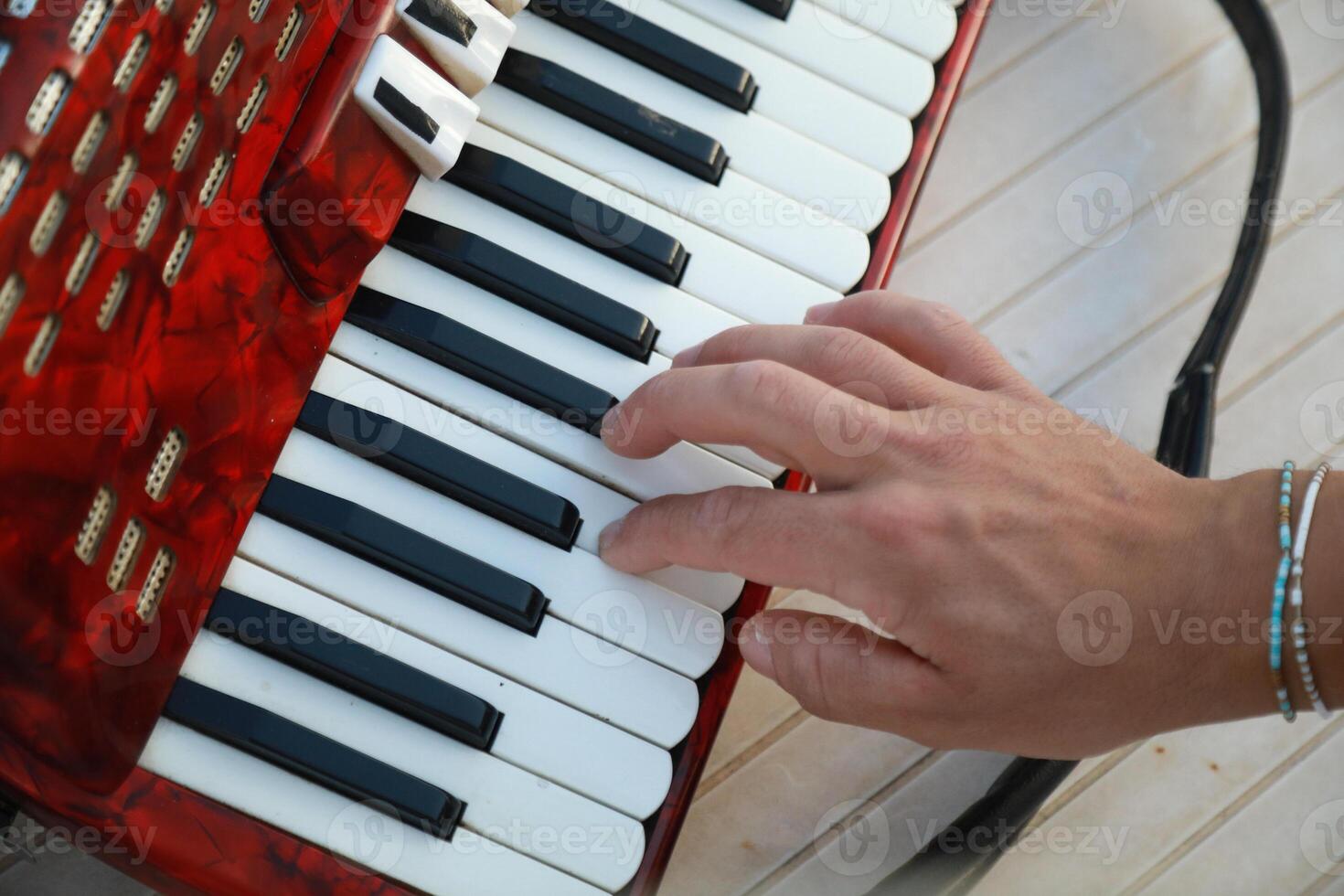 Musician's Fingers Dancing Over Accordion Keys photo