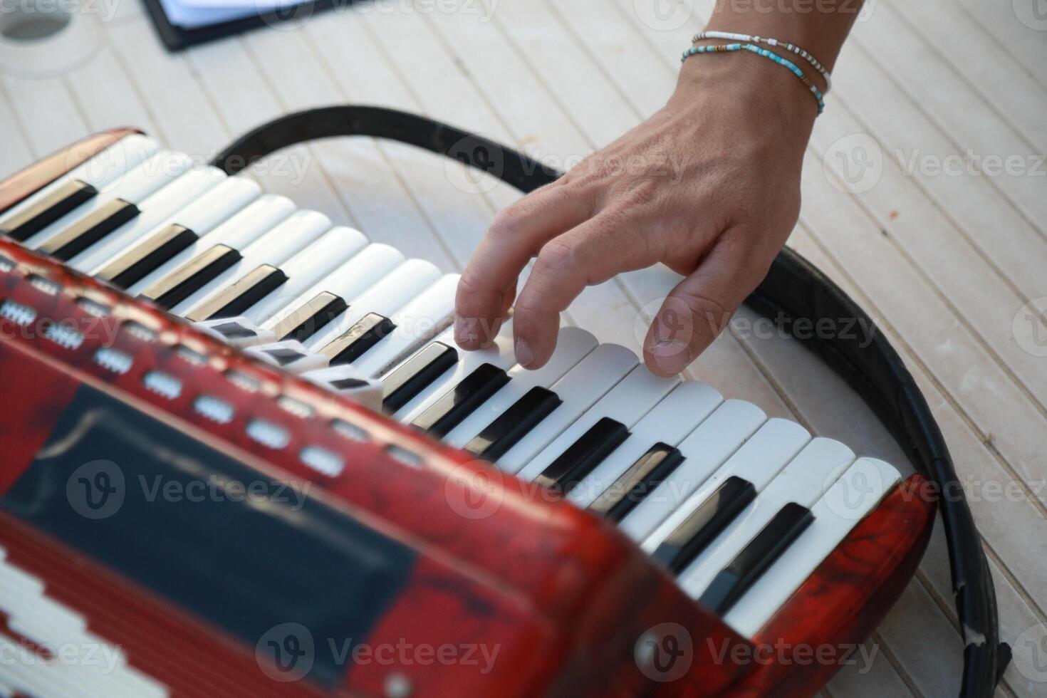 Musician's Fingers Dancing Over Accordion Keys photo
