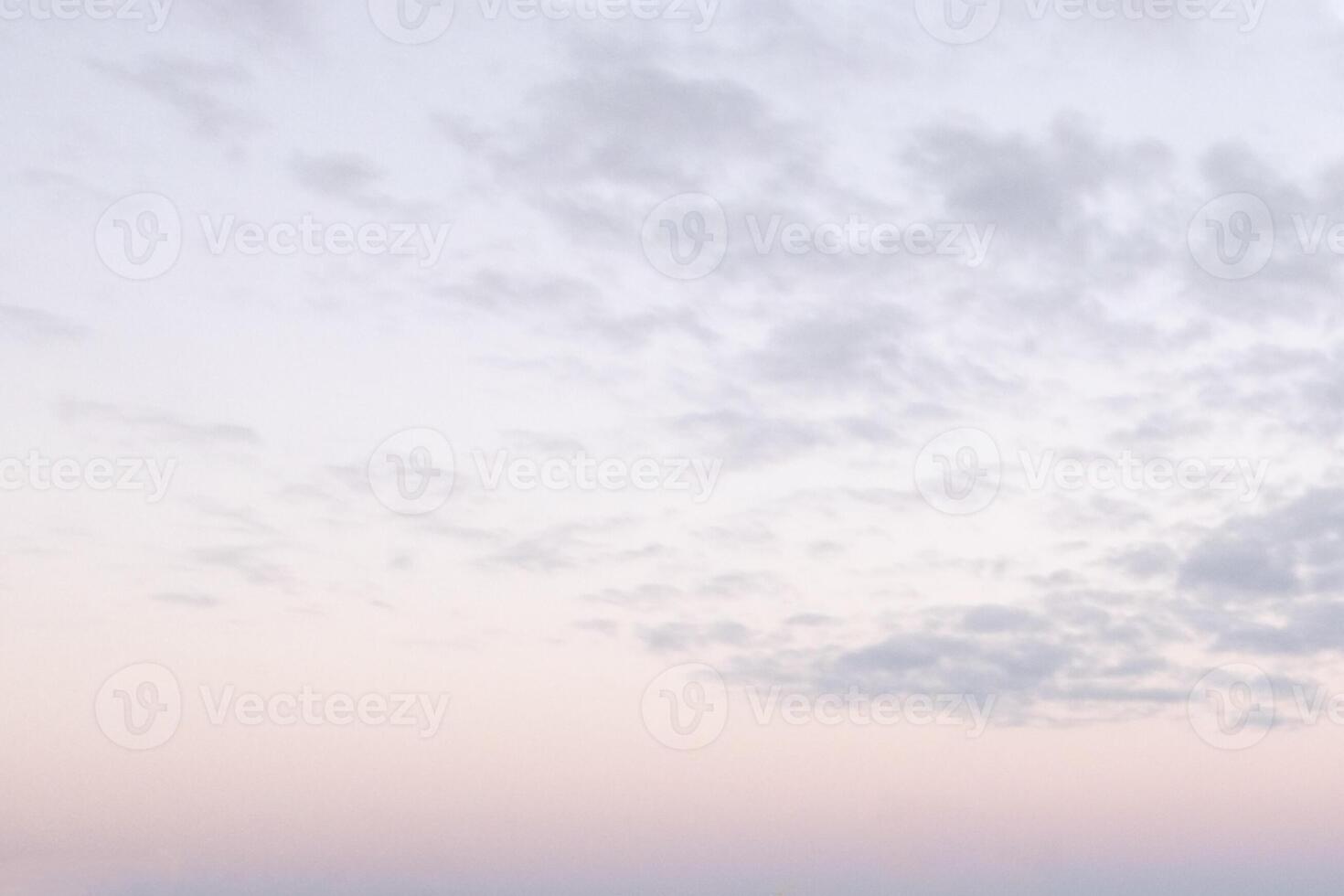 Background with small clouds on sunset sky. Nightfall is on. photo
