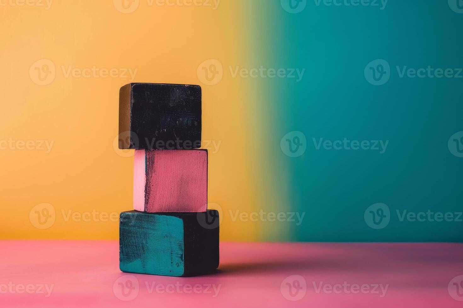 Three wooden cubes balancing on top of each other on colorful background photo